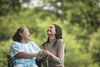  granddaughter-talking-with-her-grandmother-sitting-wheelchair-cheerful-concept-happy-family-16707767210409669507 